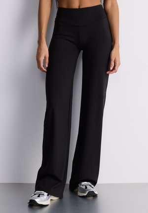 LUNGO UNITA - Pantaloni - nero