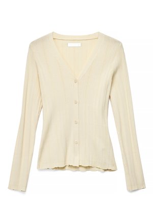 Kermanvärinen ribbineulottu neuletakki, jossa pitkät hihat, V-aukko ja neljä etunappia, hieman levenevällä helmalla.