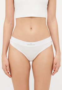 White cotton briefs with a soft waistband, featuring a subtle printed logo "Copenhagen" on the front. Simple and minimalist design.