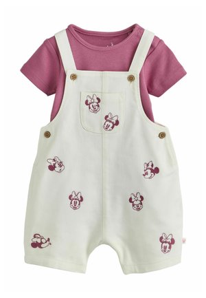 White baby romper with pink Minnie Mouse faces, worn over a short-sleeve mauve shirt, featuring buttoned straps and a front pocket.