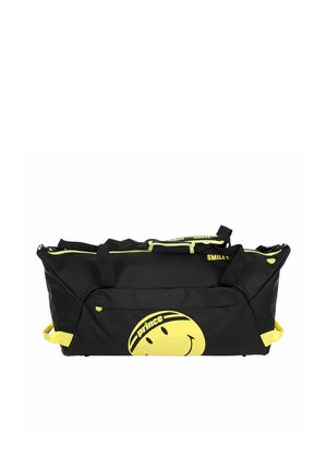 Zwart-gele sporttas met smiley-logo en de tekst "prince", voorzien van meerdere handvatten en ritssluitingen.