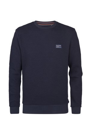 Sudadera azul marino con un diseño de punto texturizado en forma de panal. Presenta un cuello redondo, puños de canalé y un parche con el logo en el pecho.