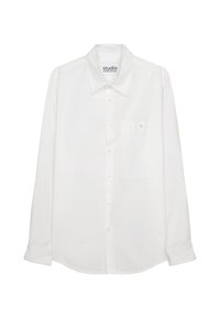 Witte lange mouwen overhemd met knopen, gemaakt van katoen. Het heeft een puntige kraag en een enkele borstzak met knoopsluiting.