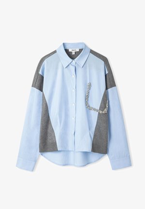 Light blue and gray button-up shirt with a collar, featuring a textured gray fabric, a decorative trim on the pocket, and a curved hem.