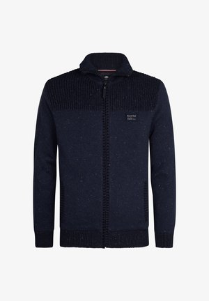 Cardigan tricoté navy avec fermeture éclair sur le devant, dotée de panneaux supérieurs texturés, de poignets côtelés et de détails mouchetés subtils sur l'ensemble.