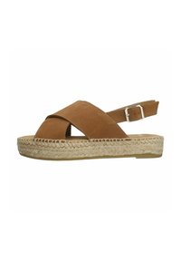 Sandale espadrille en daim marron avec des brides croisées et une boucle de cheville. Semelle en jute, talon plat et design ouvert.