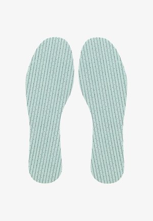 Green insoles with vertical white stripes and small black dots, designed for comfort, featuring a smooth, textured surface.
