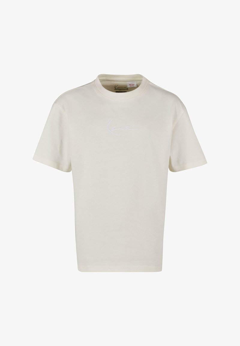 Krēmveida T-krekls ar īsām piedurknēm, izgatavots no mīkstas kokvilnas, ar diskrētu uzšūtu logo baltā krāsā krūtīs. Apaļa apakšizgriezuma kakla daļa.