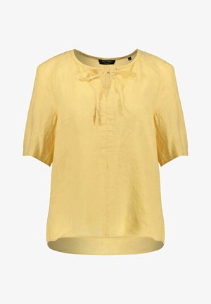 Geel linnen blouse met korte mouwen, v-hals en strikdetail aan de voorkant. Heeft een ontspannen pasvorm en een licht gebogen zoom.