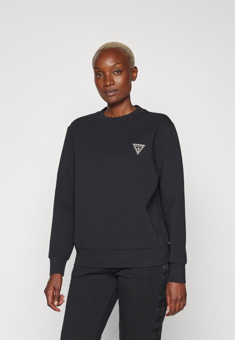 Felpa nera in misto cotone, con colletto rotondo, polsini a coste e un piccolo logo a triangolo sul petto.