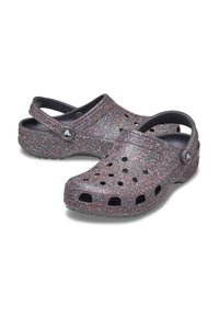 Black and gray clogs with red speckled pattern, made of durable material, featuring ventilation holes and a heel strap for secure fit.