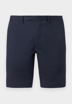 Pantaloni scurți croiți în albastru marin, cu găici pentru curea și fermoar frontal, proiectați pentru purtare casual sau semi-formală.