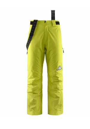 Pantaloni da sci impermeabili di colore giallo brillante con bretelle nere regolabili, tasche laterali con zip e una patch con logo sulla coscia sinistra.