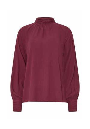 Blouse bourgogne à manches longues avec un col montant, un décolleté plissé et des poignets froncés. Fabriquée dans un tissu léger et texturé.