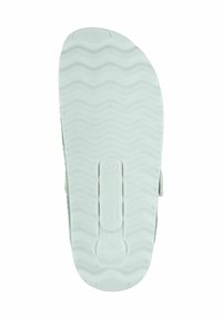 Light green rubber sole with wavy texture and branding. Size 37 marked on the footbed. No visible patterns or accents.