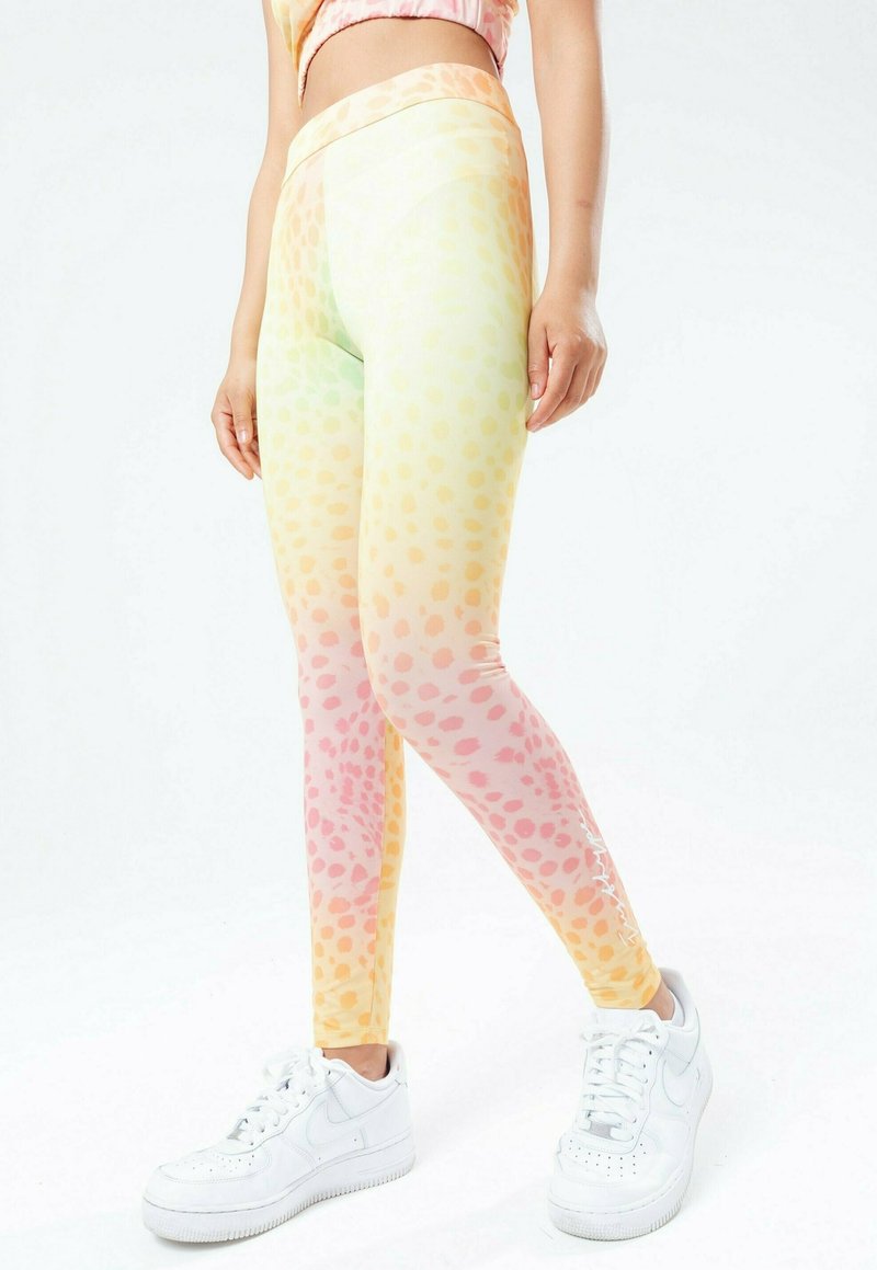 Kleurrijke leggings in gradient tinten van geel, roze en groen met een gespikkeld patroon. Voorzien van een hoge tailleband en zachte, rekbare stof.