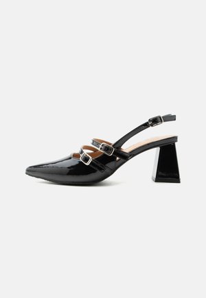 Black patent leather slingback heel with two front buckled straps and a chunky, flared 6cm heel on a plain light background.