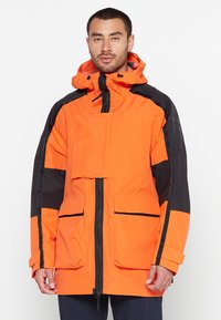 Men's jacket featuring a vibrant orange fabric with black accents, designed with a hood, multiple front pockets, and a zip closure.
