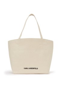 Beige Baumwolltasche mit zwei Griffen, versehen mit einem bedruckten schwarzen Logo auf der Vorderseite. Rechteckige Form mit flachem Boden.