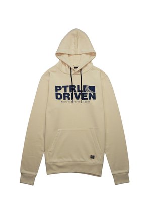Cream-colored hoodie made of soft fabric. Features a front pocket, black drawstrings, and "PTRL DRIVEN" printed in navy blue.