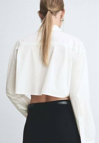 Mango Bluza s gumbima - off-white
