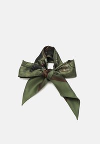 Silk scarf in green with a patterned design. Features a knot at the center and long, pointed ends. Smooth texture and shiny finish.