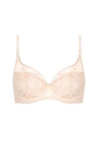 Soutien-gorge en dentelle beige avec armatures, featuring un motif floral, des bretelles ajustables et un détail nœud central. Fini en tissu transparent et lisse.