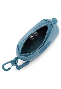 Blue zippered pouch made from a smooth material, featuring a round logo, and accented with small bead-like zipper trim. Interior label visible.