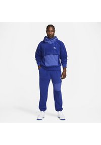 Nike Sportswear AIR WINTER PANT - Cargo trousers - deep royal blue/white