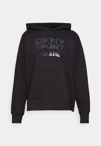 Sweat à capuche noir avec poche avant, capuche à cordon de serrage, et texte scintillant "DKNY SPORT NYC 1989" sur la poitrine.