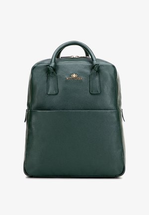 Green leather backpack with a structured design, top handles, and gold-tone hardware. Features a front pocket and textured surface.