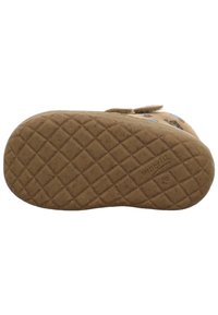 Tread pattern of a brown children's shoe sole with "superfit" and size "18" embossed on the rubber sole.