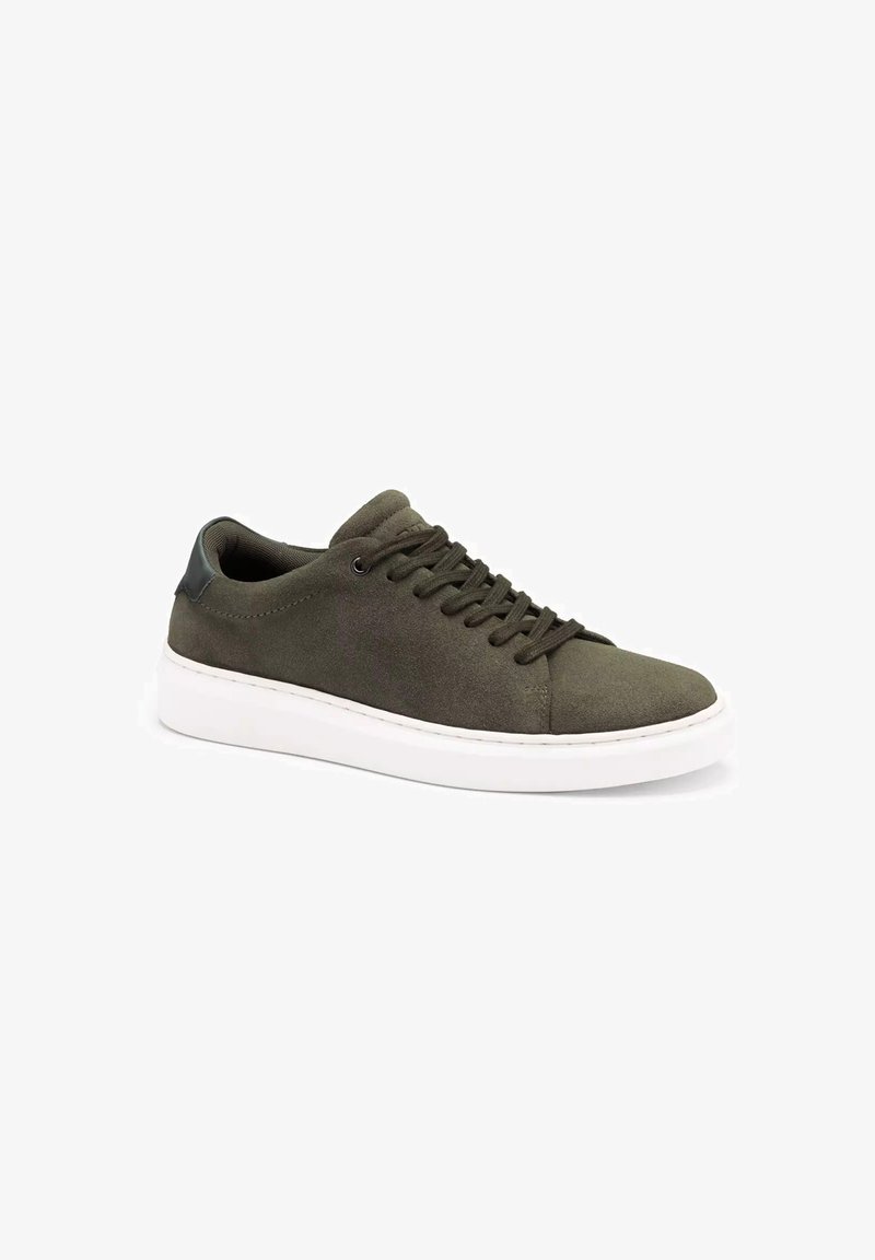 Green suede sneaker with a round toe, white rubber sole, flat laces, and smooth dark green leather accents on the heel.
