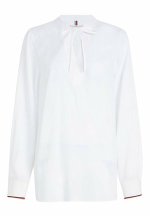 Weißes Blusenoberteil mit langen Ärmeln, runder Ausschnitthöhe und einer Schleifendetail an der Vorderseite. Verfügt über kontrastierende Manschetten mit einem Farbtupfer. Glattes Gewebe.