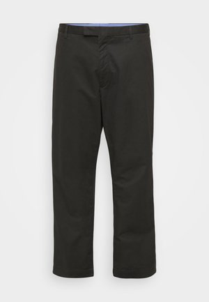 Melnas taisnas bikses ar taisnām kājām, izgatavotas no gludas auduma. Tās ir ar standarta jostasvietu, kurā ir jostas cilpas, un kāju galiem ir tīrs apdare.