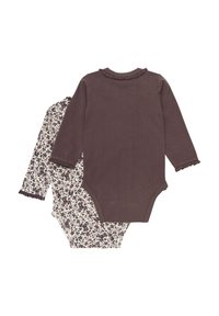Två långärmade bodysuits: en solid mörkbrun med rynkad halsringning, den andra vit med mörk blommönster och matchande rynkade ärmslut.