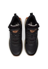 Black athletic shoes with mesh upper, textured detailing, and reflective laces. Rubber sole, brown accent on heel, and logo on tongue.