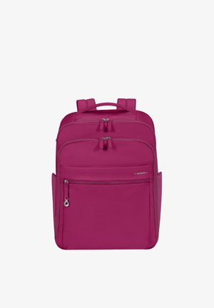Compact magenta backpack with multiple zippered compartments, side pockets, padded straps, and a top carry handle.