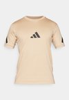Apdrukāts T-krekls - magic beige