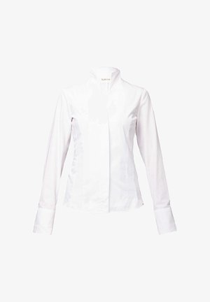 Pikad varrukad valgest puuvillast pluus. Omab seisvat kraed, esistanget ja mansette, millel on sile, poleeritud tekstuur.