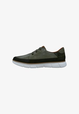 Zapatillas deportivas con parte superior de malla gris con detalles en negro, ribete marrón y suela acolchada blanca con superficie texturizada.