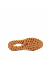 Sole of a tan rubber shoe with geometric tread patterns and the Bugatti logo embossed in the center.