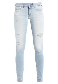 Light blue skinny jeans made of denim, featuring distressed details with rips and fading throughout. Classic five-pocket design.