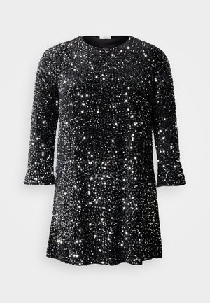 Black sequined dress with a round neckline, three-quarter sleeves, and loose fit. Surface covered in reflective, circular sequins.