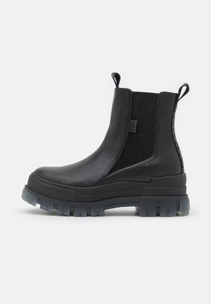 Buffalo, ASPHA CHELSEA MID - Enkellaarsjes met plateauzool - black/transparent