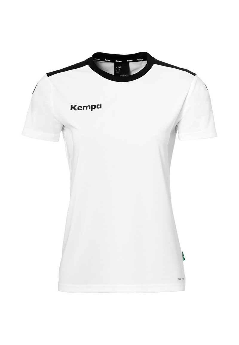 Camicetta bianca a maniche corte realizzata in tessuto liscio. Accenti neri sulle spalle. Presenta il logo "Kempa" in nero nella zona del petto sinistro.