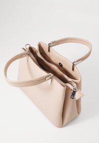 Beige leather handbag with two handles, zip closure, and two compartments. Smooth texture with silver hardware accents.