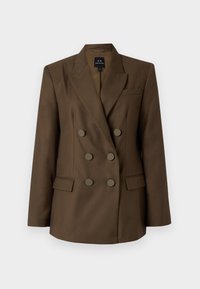 Dubbelzijdige bruine blazer met piekpels, twee voorzakken en zes ronde knopen. Glad materiaal en op maat gemaakt pasvorm.