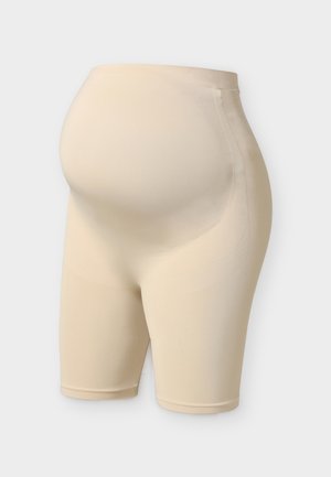 Beige nahtlose Schwangerschafts-Support-Shorts mit hohem Bund, der für einen Babybauch entwickelt wurde.