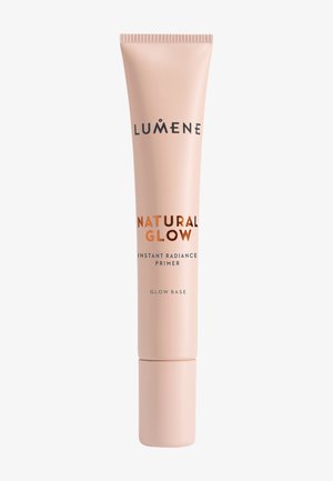 Lumene Natural Glow Instant Radiance Primer in a light beige squeeze tube with black and bronze text, standing upright on a white background.